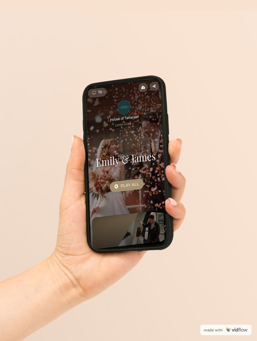 The Emily and James wedding film playing in the Vidflow app on a phone held in one hand